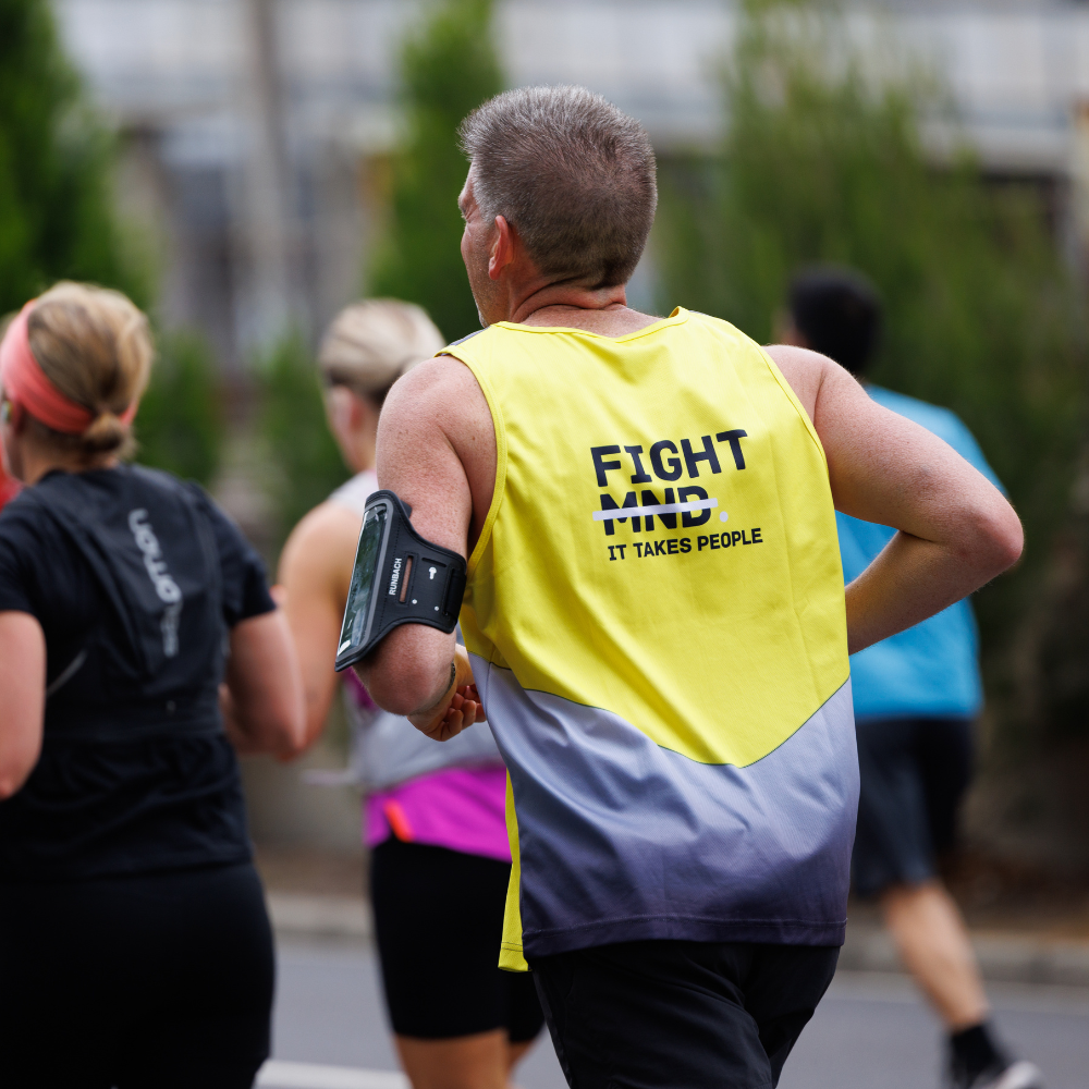 Man in a FightMND Running Singlet